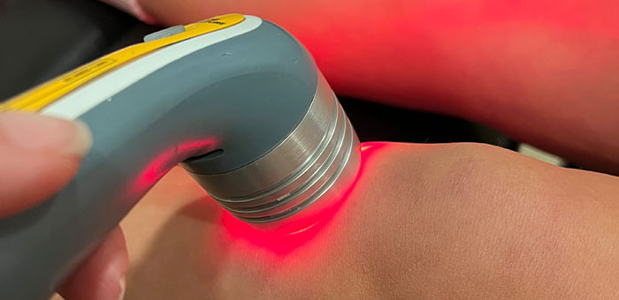 patient receiving laser therapy in La Verne