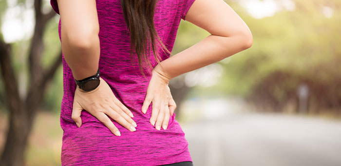 patient needing back pain treatment in La Verne