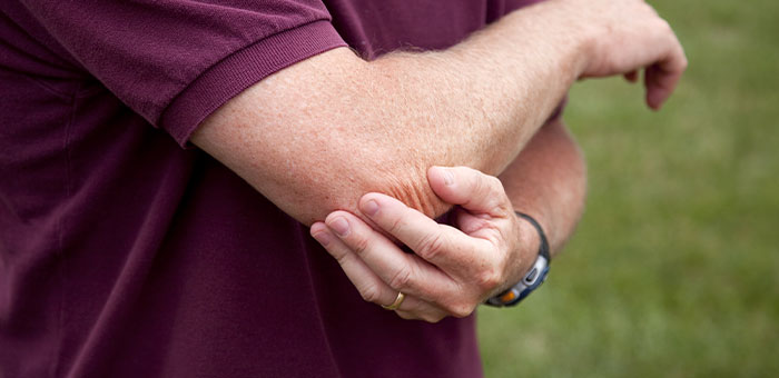 patient needing golfer's elbow treatment in La Verne